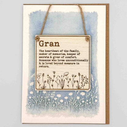 Decorative sign with text and floral design on a watercolor background