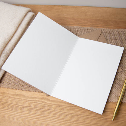 Blank inside greeting card with recycled kraft envelope