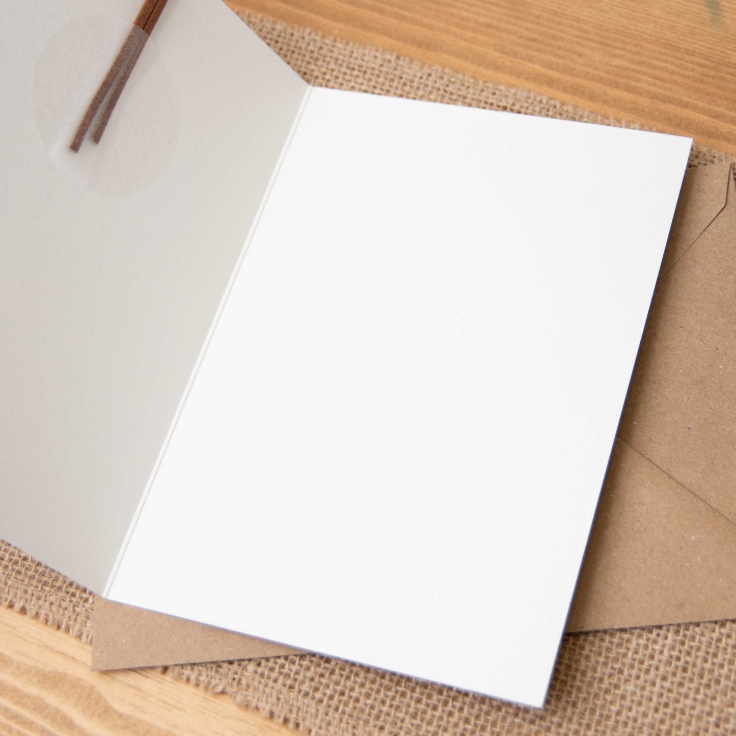 Open blank inside keepsake greeting card with kraft envelope